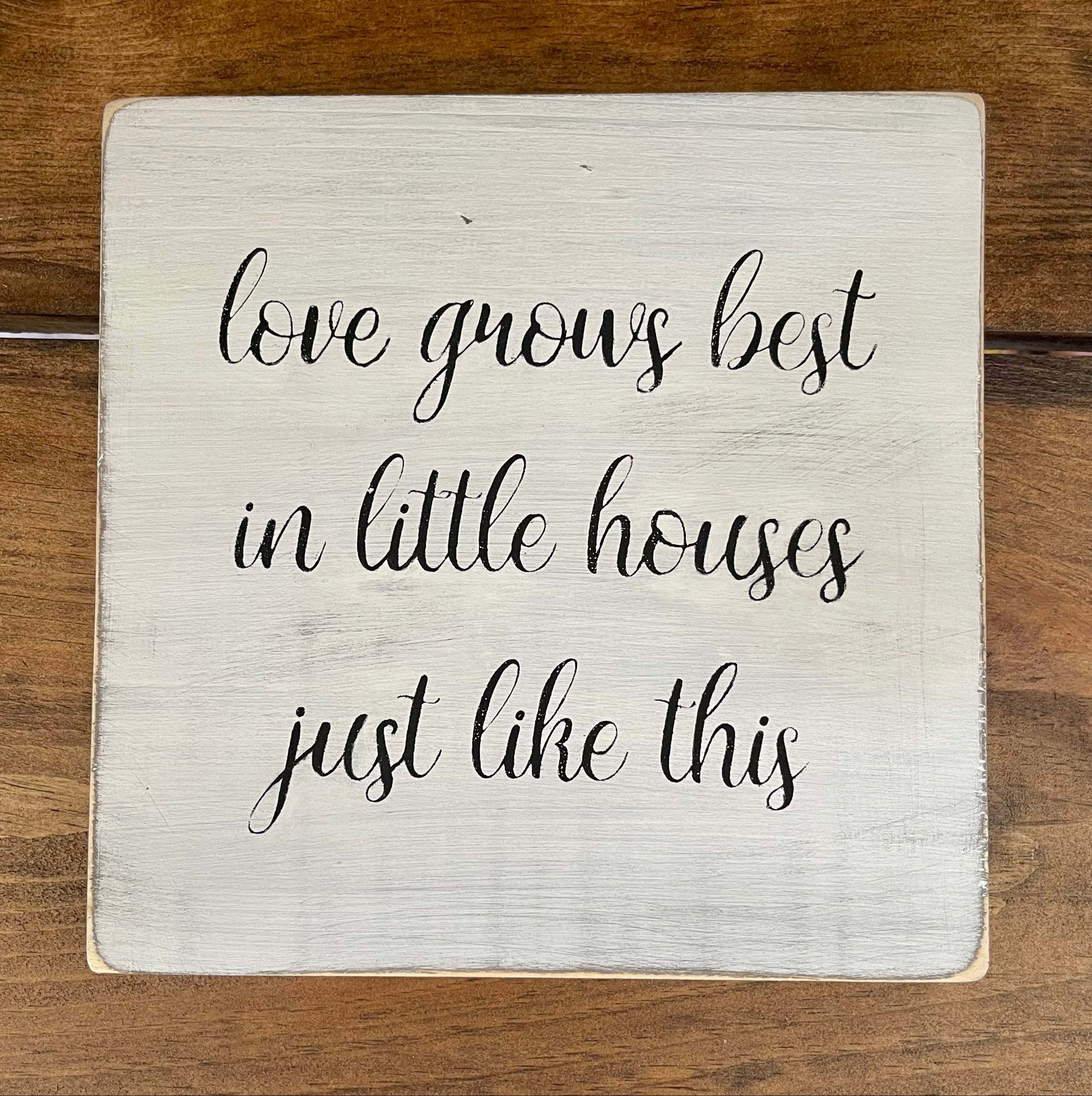 Love Grows Best wooden plank painted sign