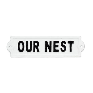 Our Nest cast-iron sign